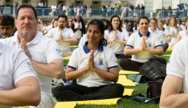 UN Photo/Mark Garten Participants join an event at UN Headquarters in New York to mark the 9th International Day of Yoga.