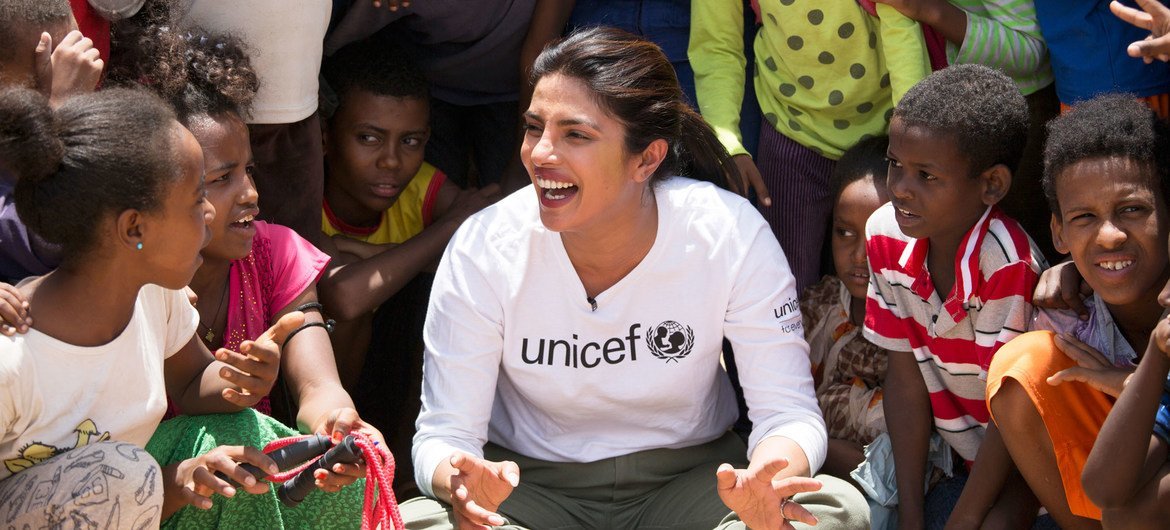 © UNICEF/Karel Prinsloo UNICEF Goodwill Ambassador Priyanka Chopra Jonas watches a football game between Eritrean refugee children and children from Ethiopia in the country's Hitsats refugee camp.