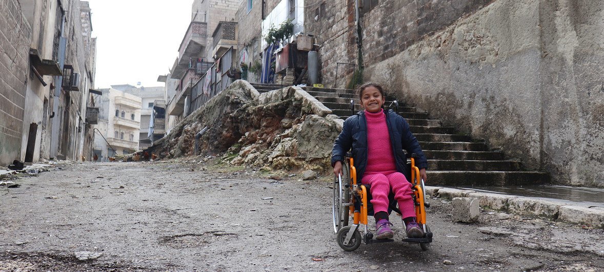 © UNICEF/Khudr Al-Issa | Eight-year-old Hanaa, who was paralysed by an exploding bomb and lost the use of her legs, sits in her wheelchair near her home in East Aleppo City, Syria. (file)