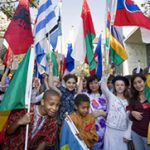 Image of children with flags from around the world