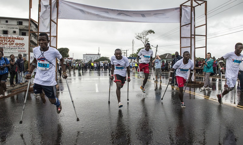 Disabled Liberian atheletes propel themselves forward at the start of the 10k mini marathon for disabled person starting from JFK Hospital in downtown Monrovia, Liberia, Sunday 25 August, 2013.
UNMIL Photo/Staton Winter