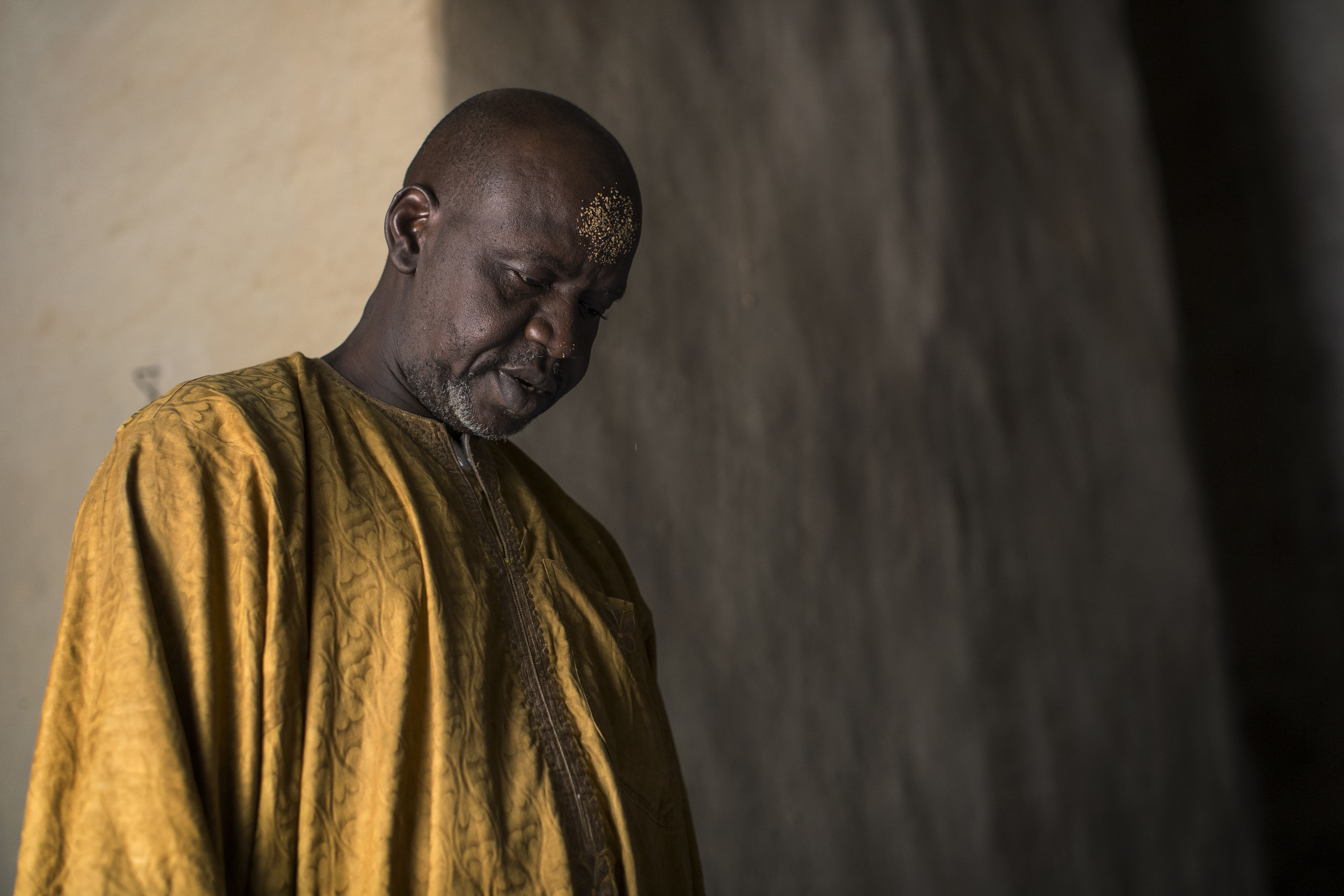 A man prays at the Great Mosque of Djenn, designated a World Heritage Site by UNESCO in 1988 along with the old town of Djenn, in the central region of Mali.