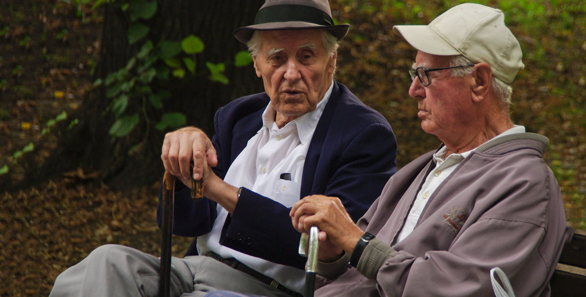 Two retirees chatting in Kamegdan Fort gardens. Elderly men.