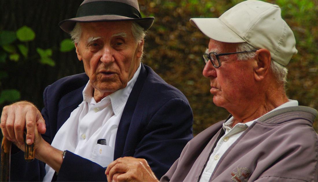 Two retirees chatting in Kamegdan Fort gardens. Elderly men.