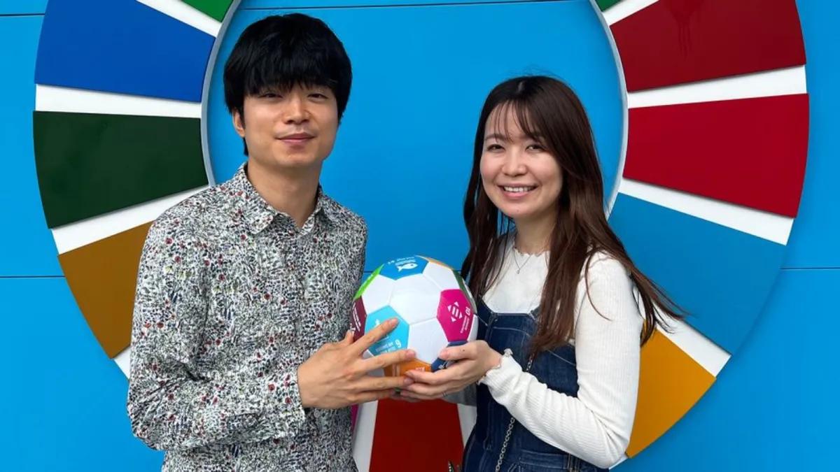 UN News/Daniel Dickinson Taro Shinzato (left) visited the UN Pavilion with Satoka Shinzato.