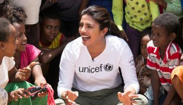 © UNICEF/Karel Prinsloo UNICEF Goodwill Ambassador Priyanka Chopra Jonas watches a football game between Eritrean refugee children and children from Ethiopia in the country's Hitsats refugee camp.