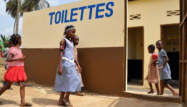 Children investigate their community's newly improved toilets, one of UNOCI's “quick impact projects” (QIPS) which supported the rehabilitation of schools and toilets in Abidjan. UN Photo/Patricia Esteve