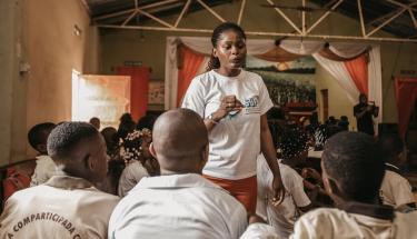 Eva Monteiro Teixeira, a mentor with the UNFPA Safeguard Young People programme, leads a discussion on sexual and reproductive health at the Escola Grafanil in Luanda. © UNFPA Angola/K Karlo Cesar