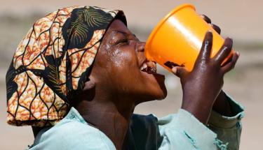 © UNICEF/Frank Dejongh A girl drinks water at school in Goré, Chad.