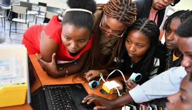 Participants during a robotics session at the first AGCCI bootcamp in Rwanda. Photo: UN Women/Geno Ochieng