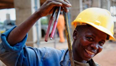 ILO Photo/Marcel Crozet A young construction worker in Lilongwe, the capital of Malawi.