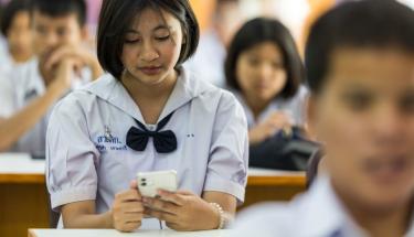 UNFPA Thailand High school students in Phuket, Thailand, use a UNFPA-backed chatbot.